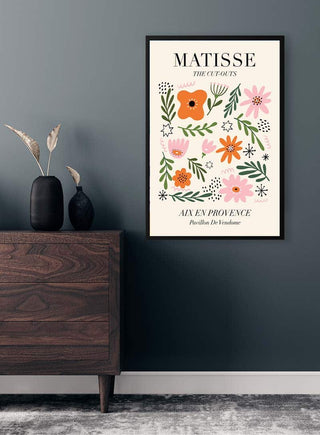 Framed Matisse Inspired Provence Plakat with floral artwork hanging on a dark wall above a wooden dresser.