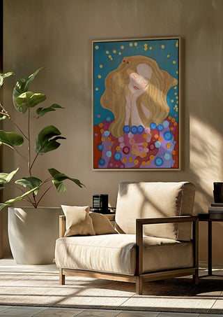 The dreamer by Gerard Ceulemans framed above a beige armchair beside a potted plant