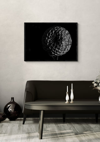 Lunar Bloom by Guido Lucker framed above a dark sofa beside a candlestick and a vase