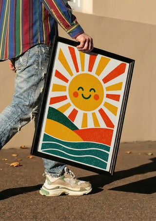 Smiling Sun by Decker Studios carried in a black frame along a sunny street