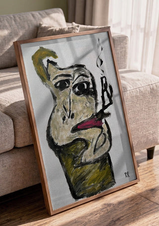 Pipan by RR in a walnut frame leaning against a grey sofa