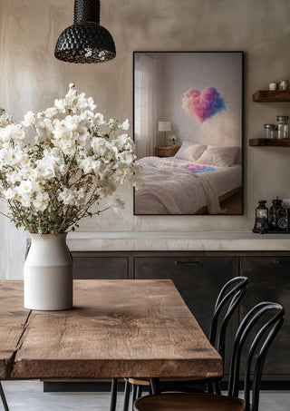 A Private Weather by Haris Delic in a black frame above a rustic table with white flowers
