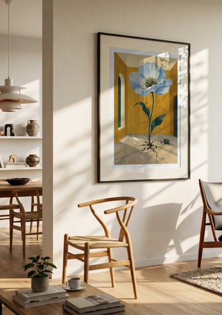 The Room That Bloomed by Matthews Gallerie in a black frame in a bright dining room with wooden chairs