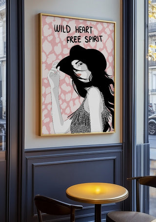 Wild heart, free spirit by Lisen Vennesland in an oak frame on a panelled café wall