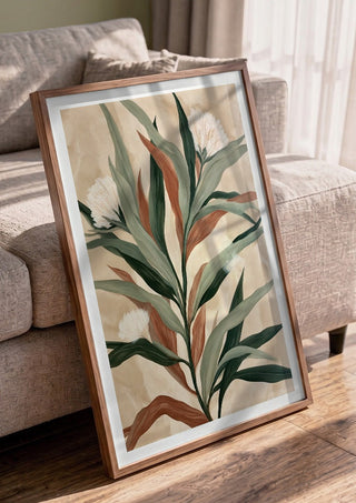 Sage and Rust by Martina Karlsson in a walnut frame leaning against a grey sofa