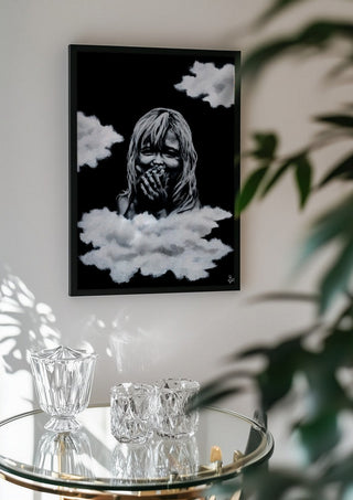 innocence by Sofia de Lemos in a black frame above a glass table with crystal glassware