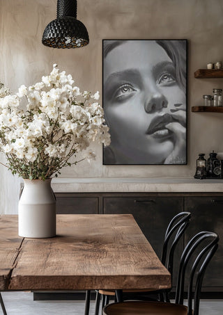 the dreamer by Sofia de Lemos in a black frame above a rustic table with white flowers