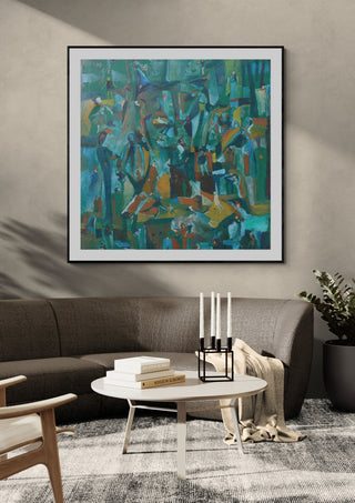 Forest of Figures by António D'Albuquerque in a black frame above a grey sofa with candlesticks on a round table