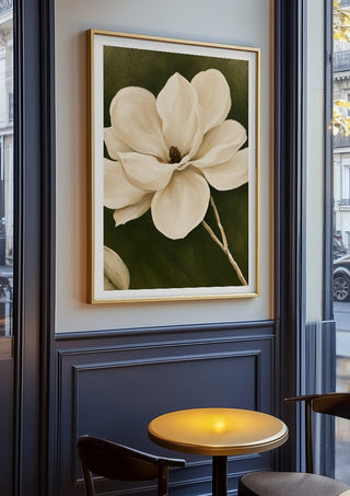 White Magnolia by Martina Karlsson in an oak frame on a panelled cafe wall