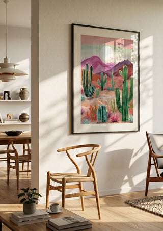 Cactus desert by Ohkimiko in a black frame in a bright dining room with wooden chairs