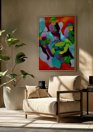 Mariachis by Nittaart framed above a beige armchair beside a potted plant