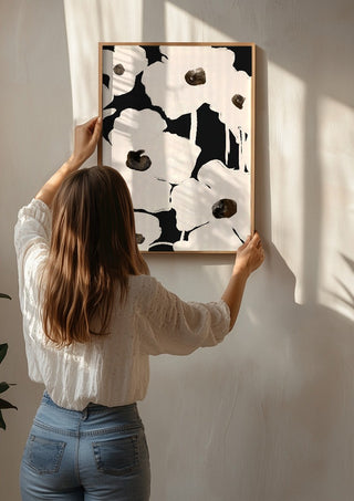 Abstract Flowers by ThingDesign being hung on a sunlit wall