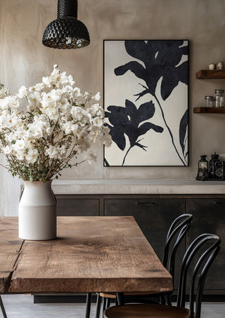 Shadowed Blooms by ThingDesign in a black frame above a rustic table with white flowers