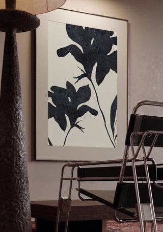 Shadowed Blooms by ThingDesign framed in a dim room beside a tubular steel chair