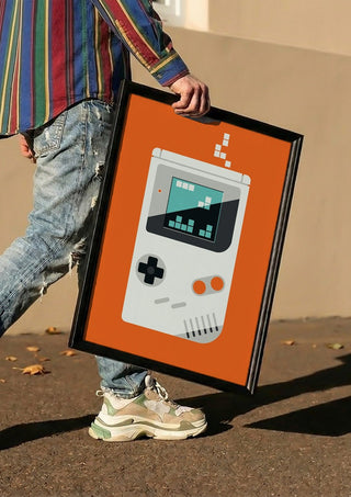 Playing games by Bo Lundberg carried in a black frame along a sunny street