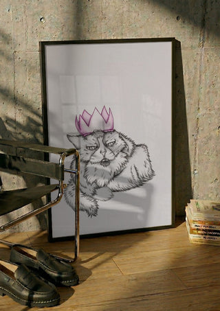 King Tony the cat by CarolineV in a black frame leaning against a concrete wall by a steel chair