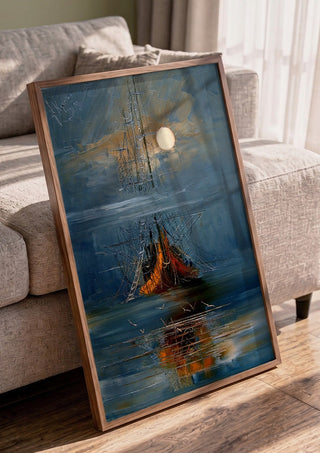 Moon over the Ship by Justyna Kopania in a walnut frame leaning against a grey sofa