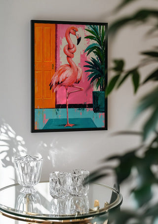 Knot today x Flamingo by Decker Studios in a black frame above a glass table with crystal glassware