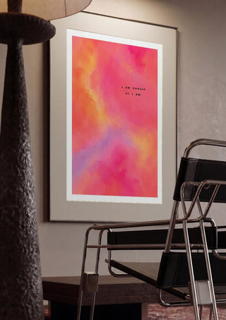 I Am Enough by Decker Studios framed in a dim room beside a tubular steel chair