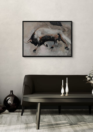 Unleashed by Lüba in a black frame above a dark sofa with candlesticks on a round table