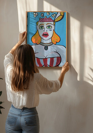Popcornbrain by KaroGaiaArt being hung on a sunlit wall