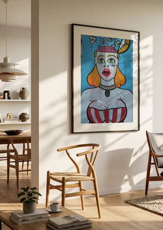 Popcornbrain by KaroGaiaArt in a black frame in a bright dining room with wooden chairs