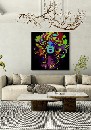 The Flowing Mane by BunteBeute in a black frame above a cream sofa under a branch chandelier