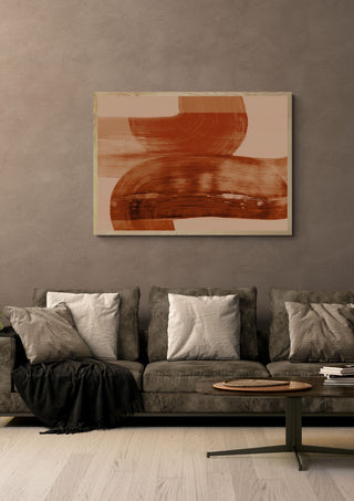 abstract shapes autumn orange by Iris Lehnhardt in a light oak frame above a grey sofa on a warm brown wall