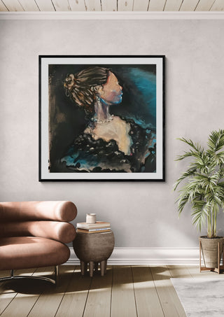 The Rich Lady by Christin in a black frame above a leather armchair beside a potted palm