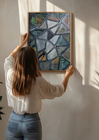 Cracked Glass by Fredprikas being hung on a sunlit wall