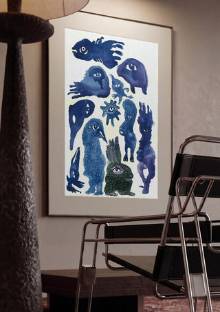 Creatures 2 by Lena Galé framed in a dim room beside a tubular steel chair