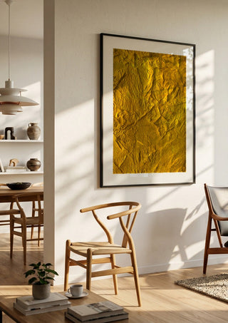 Das Licht in uns by Sophie Schillen in a large black frame in a bright dining room