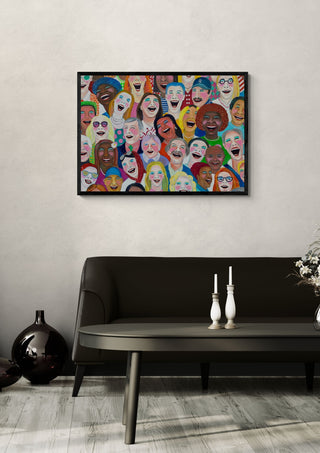 Can´t stop laughing by María Burgaz in a black frame on a pale wall above a dark sofa with candlesticks