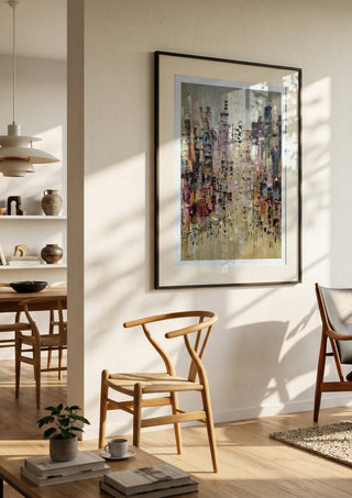 A Thousand windows by Art Anne Lee in a black frame in a bright dining room with wooden chairs