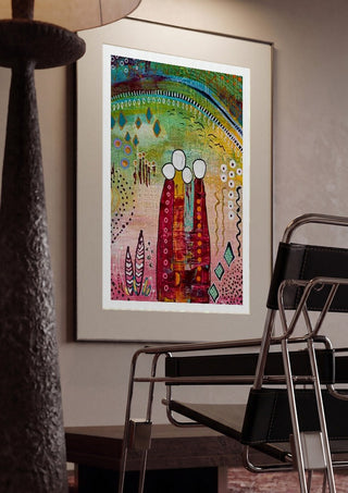 Fairy Tale 1 by Art Anne Lee framed in a dim room beside a tubular steel chair