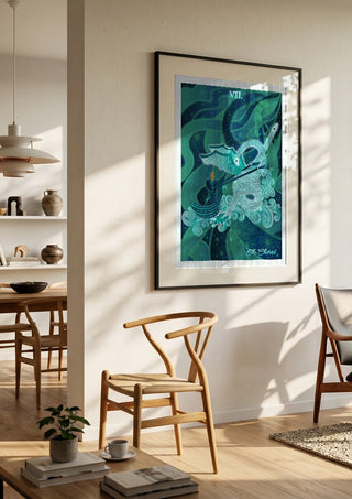 The Chariot by Sciurus tarotus in a black frame in a bright dining room with wooden chairs
