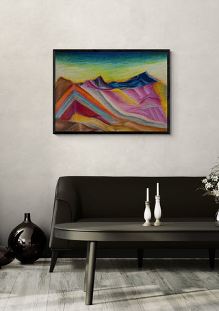 Mountains by Emil Walli in a black frame on a pale wall above a dark sofa with candlesticks
