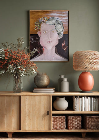 Looksmaxxer Deluxe by Emil Walli above a wooden sideboard on a sage green wall