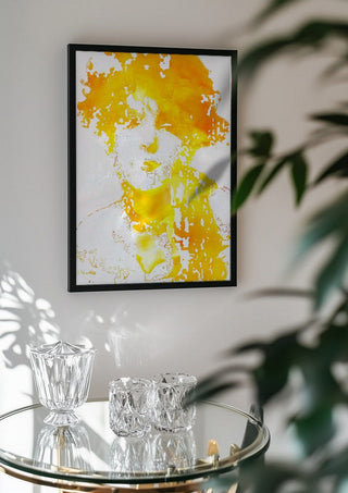 Sunshine by Bent Hardervig in a black frame above a glass table with crystal glassware
