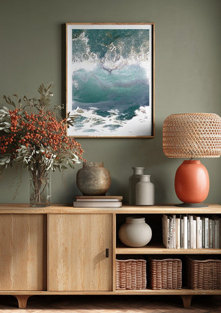 Suddenly Hello by Bent Hardervig above a wooden sideboard on a sage green wall