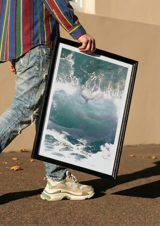 Suddenly Hello by Bent Hardervig carried in a black frame along a sunny street
