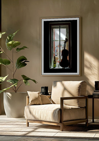A Nice Day by Bent Hardervig framed above a beige armchair beside a potted plant