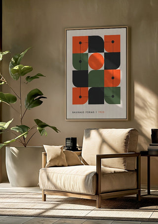 Bauhaus Forms 1923 by Neil Stevens framed above a beige armchair beside a potted plant