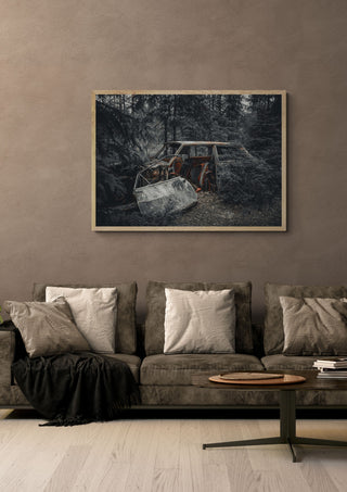 Decay (2) by Lone Gjessing in a light oak frame on a warm grey wall above a brown sofa