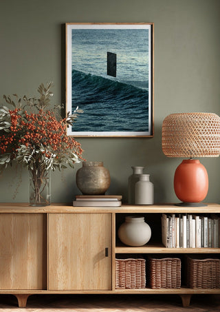 Deep Blue by Fran Rodriguez above a wooden sideboard on a sage green wall