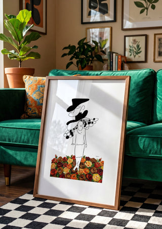 The weight of the world by Madame Petit in a wooden frame leaning against a green velvet sofa on a chequered floor