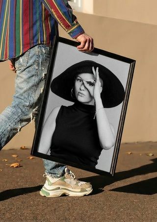 Back in time by Bettinafloorphoto carried in a black frame along a sunny street