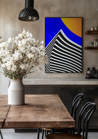 Pyramid by Aleksi Allan in a black frame above a rustic table with white flowers