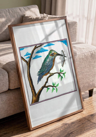 Bird with a Book by Waldemar Mandzel in a walnut frame leaning against a grey sofa