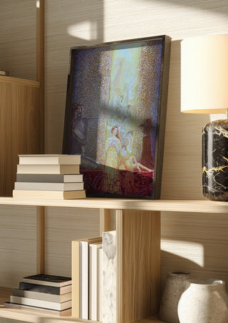 Women and Men by Ramz Gadzh in a dark frame on a wooden shelf beside books and a lamp